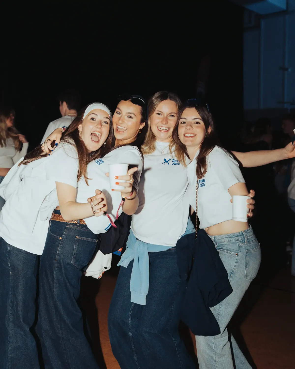 Group of members in matching SSX t-shirts on a night out