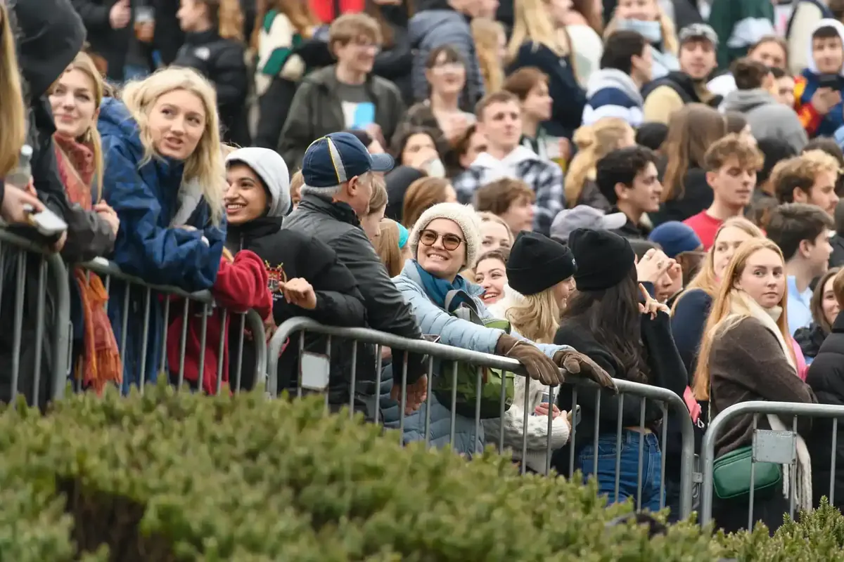 Spectators packed against the barriers watching Chill Hill on campus